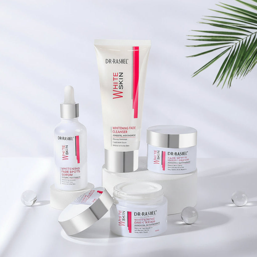 A skincare product set by DR. RASHEL including a serum, cleanser, day cream, and night cream designed for whitening and even skin tone.