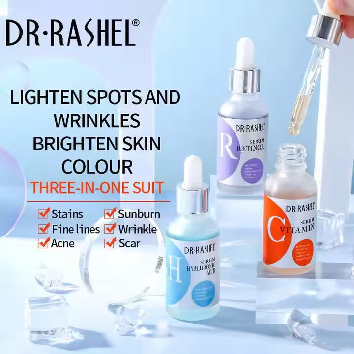 Pack of 3 Dr. Rashel Complete Facial Serums, with individual bottles labeled Vitamin C, Retinol, and Hyaluronic Acid, displayed in front of their packaging.